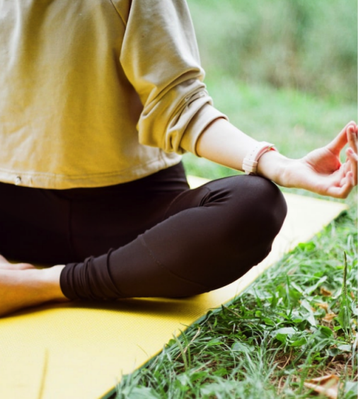 a Girl is setting in Yoga Pose